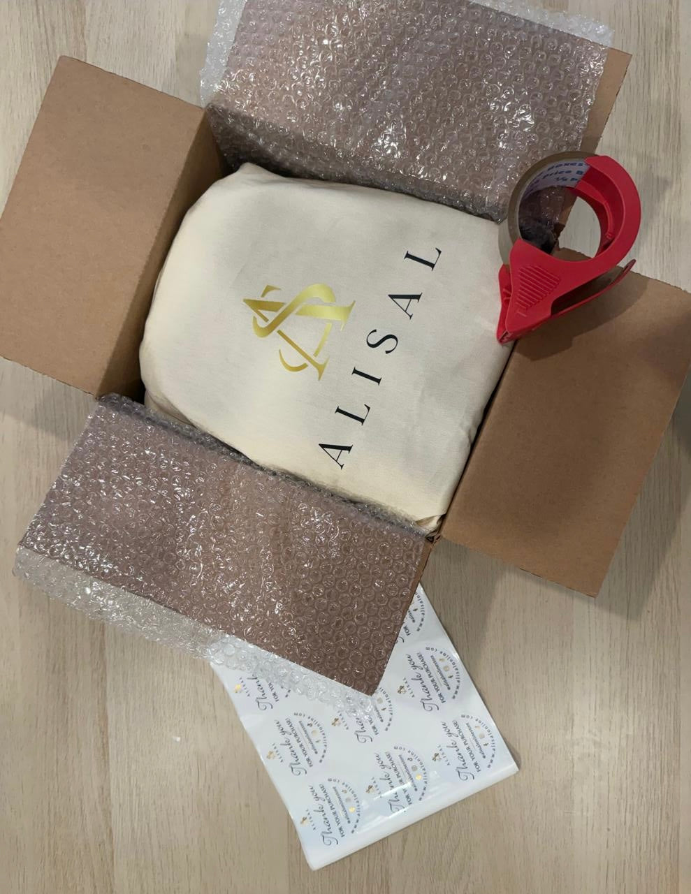 Product packaging with 'ALISAL' branding